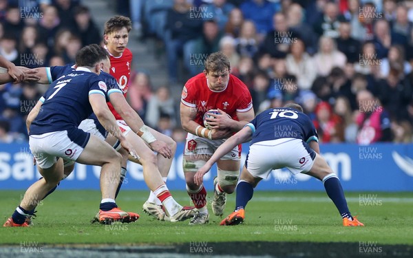 080325 - Scotland v Wales - Guinness 6 Nations Championship - Jac Morgan of Wales is tackled by Finn Russell of Scotland 