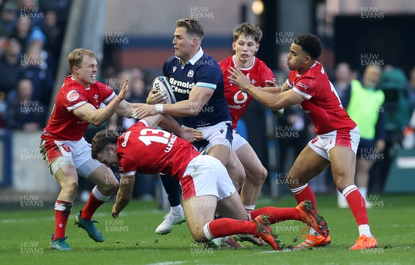 080325 - Scotland v Wales - Guinness 6 Nations Championship - Duhan van der Merwe of Scotland is tackled by Blair Murray, Max Llewellyn, Ellis Mee and Ben Thomas of Wales 