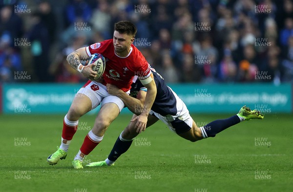 080325 - Scotland v Wales - Guinness 6 Nations Championship - Joe Roberts of Wales is tackled by Blair Kinghorn of Scotland 