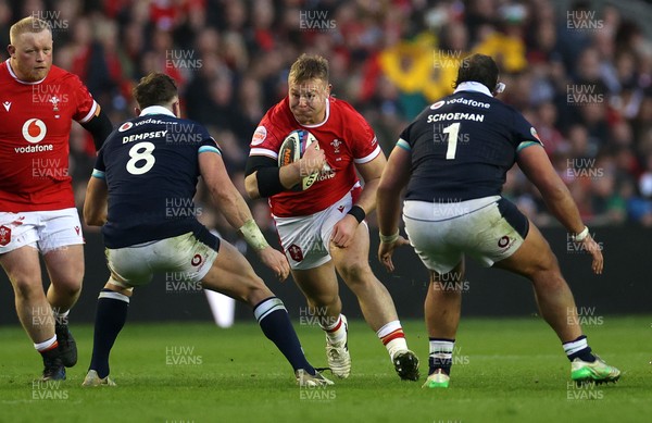 080325 - Scotland v Wales - Guinness 6 Nations Championship - Dewi Lake of Wales is challenged by Jack Dempsey of Scotland 