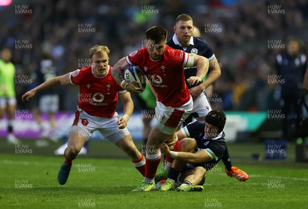 080325 - Scotland v Wales - Guinness 6 Nations Championship - Joe Roberts of Wales is tackled by Darcy Graham of Scotland 