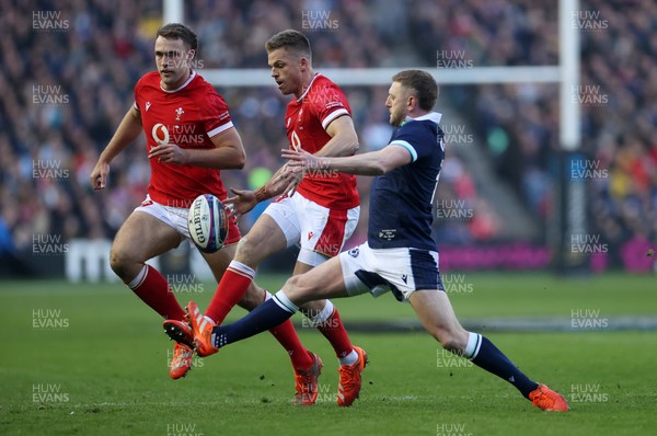 080325 - Scotland v Wales - Guinness 6 Nations Championship - Gareth Anscombe of Wales is challenged by Finn Russell of Scotland 