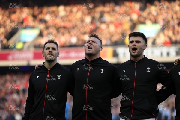 080325 - Scotland v Wales - Guinness 6 Nations Championship - Tomos Williams, Dewi Lake and Joe Roberts sing the anthem