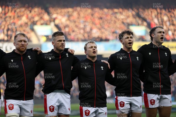 080325 - Scotland v Wales - Guinness 6 Nations Championship - Tommy Reffell, Gareth Anscombe, Blair Murray, Tom Rogers and Max Llewellyn sing the anthem