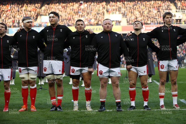 080325 - Scotland v Wales - Guinness 6 Nations Championship - Aaron Wainwright, Teddy Williams, Elliot Dee, Keiron Assiratti, Jarrod Evans and Ellis Mee sing the anthem