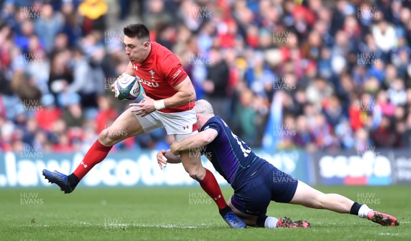 090319 - Scotland v Wales - Guinness Six Nations - Josh Adams of Wales is tackled by Nick Grigg of Scotland