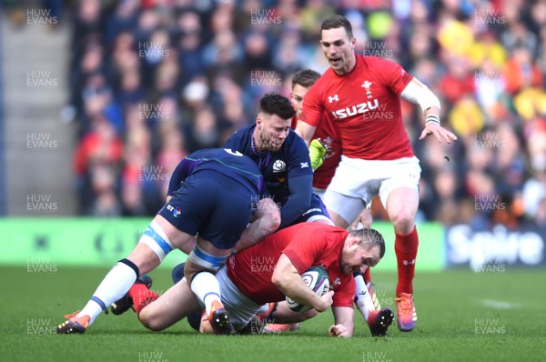 090319 - Scotland v Wales - Guinness Six Nations - Ken Owens of Wales is tackled by Magnus Bradbury of Scotland