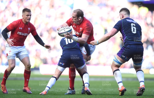 090319 - Scotland v Wales - Guinness Six Nations - Alun Wyn Jones of Wales is tackled by Finn Russell of Scotland