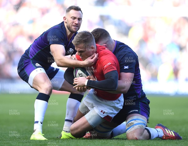 090319 - Scotland v Wales - Guinness Six Nations - Gareth Anscombe of Wales is tackled by Byron McGuigan and Magnus Bradbury of Scotland