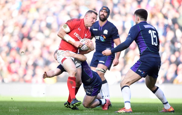 090319 - Scotland v Wales - Guinness Six Nations - Hadleigh Parkes of Wales is tackled by Byron McGuigan of Scotland