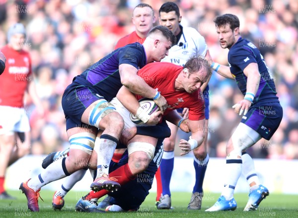 090319 - Scotland v Wales - Guinness Six Nations - Alun Wyn Jones of Wales is tackled by Magnus Bradbury and Finn Russell of Scotland