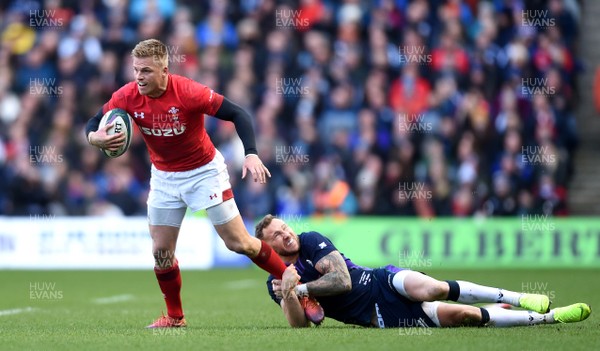 090319 - Scotland v Wales - Guinness Six Nations - Gareth Anscombe of Wales is tackled by Byron McGuigan of Scotland