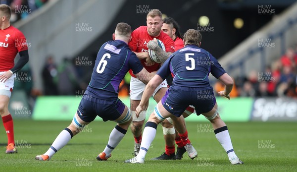 090319 - Scotland v Wales - Guinness 6 Nations - Ross Moriarty of Wales is tackled by Magnus Bradbury and Jonny Gray of Scotland