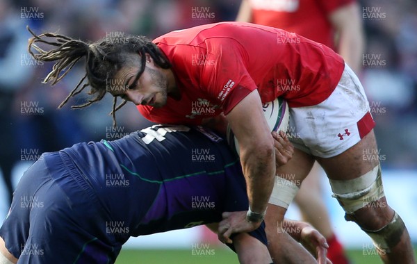 090319 - Scotland v Wales - Guinness 6 Nations - Josh Navidi of Wales is tackled by Grant Gilchrist of Scotland