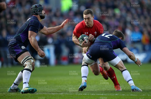 090319 - Scotland v Wales - Guinness 6 Nations - George North of Wales is tackled by Pete Horne of Scotland