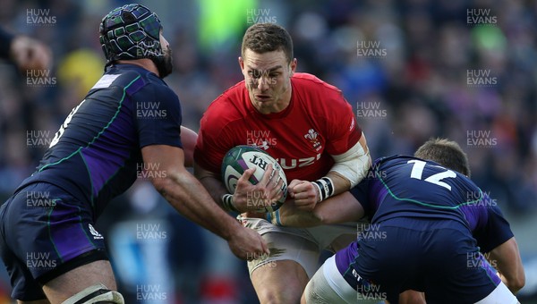 090319 - Scotland v Wales - Guinness 6 Nations - George North of Wales is tackled by Jonny Gray and Pete Horne of Scotland
