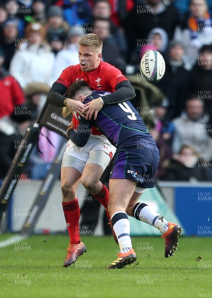 090319 - Scotland v Wales - Guinness 6 Nations - Gareth Anscombe of Wales is tackled off the ball by Ali Price of Scotland