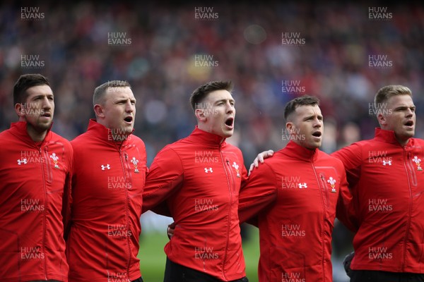 090319 - Scotland v Wales - Guinness 6 Nations - Josh Adams (centre) sings the anthem