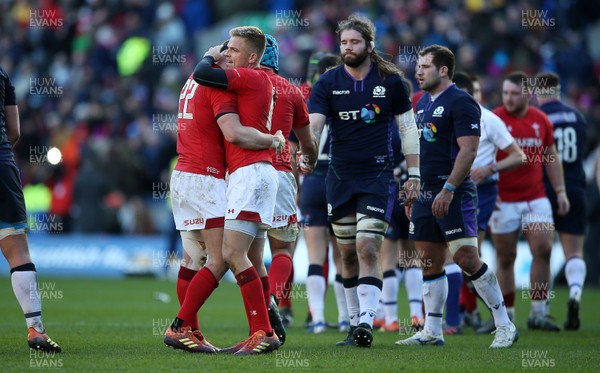 090319 - Scotland v Wales - Guinness 6 Nations - Dan Biggar and Gareth Anscombe of Wales hug at full time