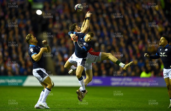 110223 - Scotland v Wales - Guinness Six Nations 2023 - Alex Cuthbert of Wales and Finn Russell of Scotland compete for high ball