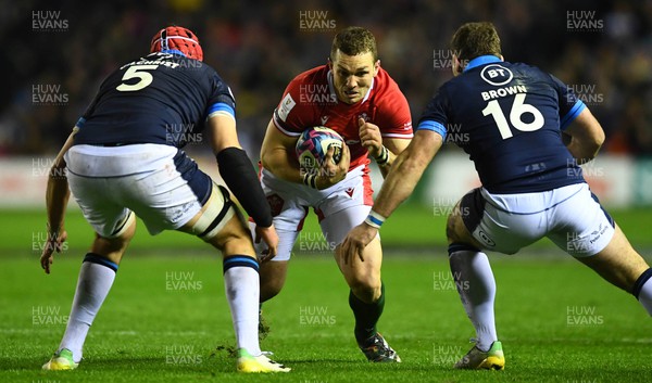 110223 - Scotland v Wales - Guinness Six Nations 2023 - George North of Wales takes on Grant Gilchrist and Fraser Brown of Scotland
