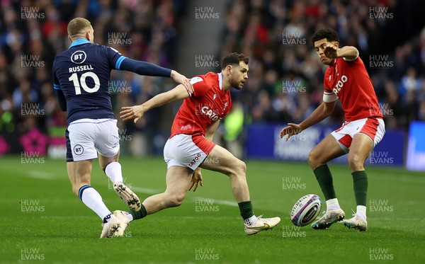 110223 - Scotland v Wales - Guinness 6 Nations Championship - Tomos Williams of Wales blocks the kick of Finn Russell of Scotland 