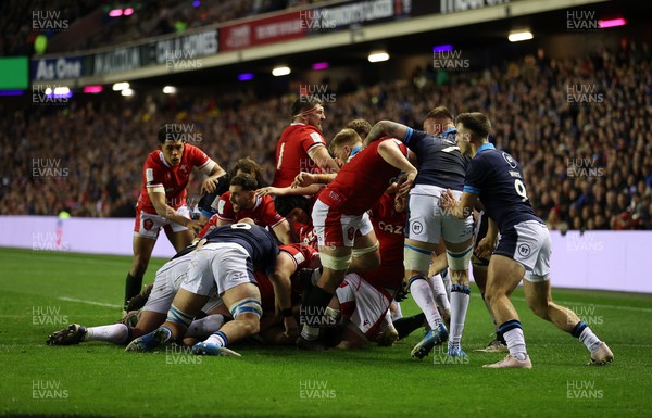 110223 - Scotland v Wales - Guinness 6 Nations Championship - Ken Owens of Wales is pushed over the line to score a try