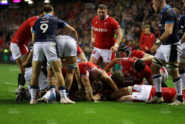 110223 - Scotland v Wales - Guinness 6 Nations Championship - Ken Owens of Wales is pushed over the line to score a try