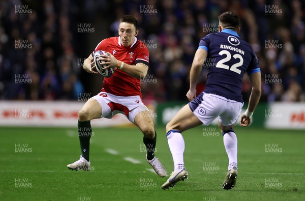 110223 - Scotland v Wales - Guinness 6 Nations Championship - Josh Adams of Wales is challenged by Blair Kinghorn of Scotland 