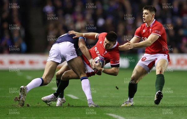 110223 - Scotland v Wales - Guinness 6 Nations Championship - Josh Adams of Wales is tackled by Blair Kinghorn of Scotland 