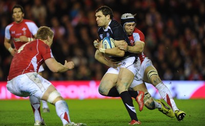 12.02.11 - Scotland v Wales - RBS Six Nations 2011 - Sean Lamont of Scotland is tackled by Bradley Davies and Ryan Jones of Wales. 