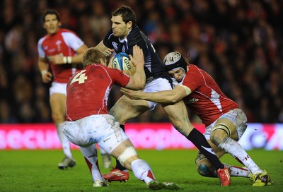 12.02.11 - Scotland v Wales - RBS Six Nations 2011 - Sean Lamont of Scotland is tackled by Bradley Davies and Ryan Jones of Wales. 