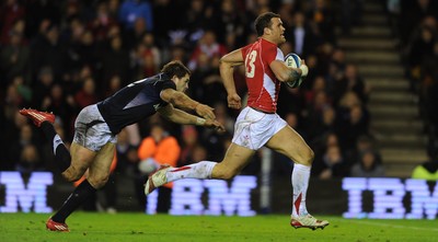 12.02.11 - Scotland v Wales - RBS Six Nations 2011 - Jamie Roberts of Wales gets away from Sean Lamont of Scotland. 