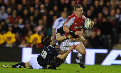 12.02.11 - Scotland v Wales - RBS Six Nations 2011 - Matthew Rees of Wales is tackled by Mike Blair of Scotland. 