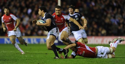 12.02.11 - Scotland v Wales - RBS Six Nations 2011 - Joe Ansbro of Scotland is tackled by Jamie Roberts and Josh Turnbull of Wales. 