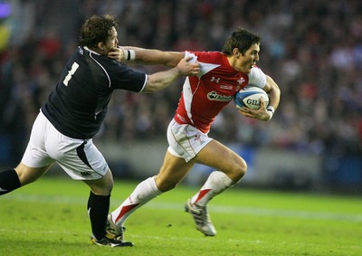 12.02.11 - Scotland v Wales... Wales James Hook hands off Allan Jacobsen. 