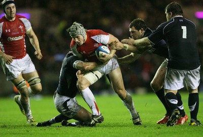 12.02.11 - Scotland v Wales... Wales  Jonathan Davies finds a gap .. 