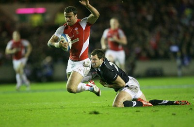 12.02.11 - Scotland v Wales... Wales  Jamie Roberts is tackled by Sean Lamont.. . 
