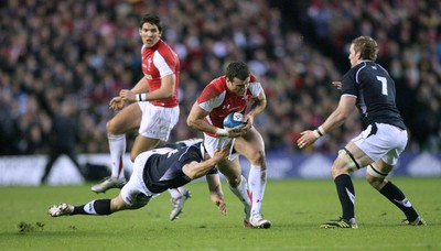 12.02.11 - Scotland v Wales... Wales Jamie Roberts is tackled by Nick De Luca. 