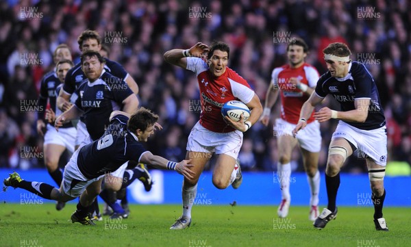 12.02.11 - Scotland v Wales - RBS Six Nations 2011 - James Hook of Wales beats Rory Lawson(L) of Scotland. 