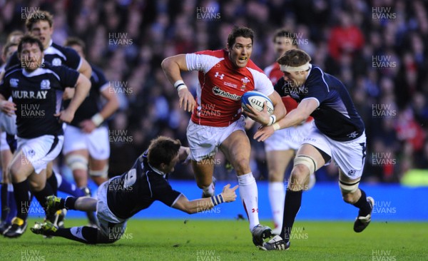 12.02.11 - Scotland v Wales - RBS Six Nations 2011 - James Hook of Wales beats Rory Lawson(L) of Scotland. 