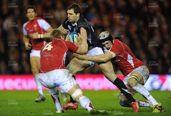 12.02.11 - Scotland v Wales - RBS Six Nations 2011 - Sean Lamont of Scotland is tackled by Bradley Davies and Ryan Jones of Wales. 