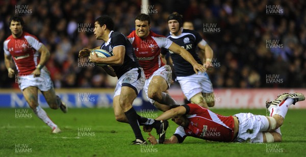 12.02.11 - Scotland v Wales - RBS Six Nations 2011 - Joe Ansbro of Scotland is tackled by Jamie Roberts and Josh Turnbull of Wales. 