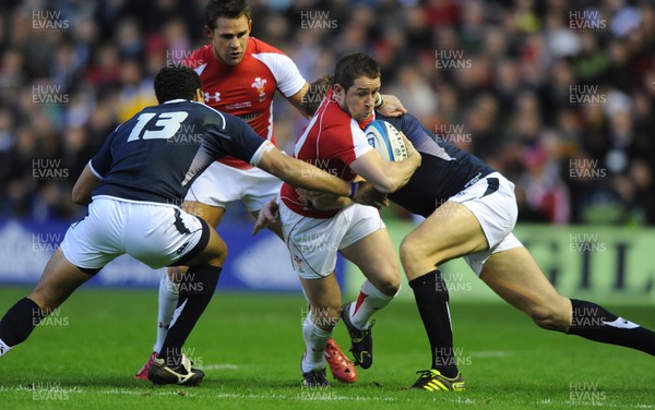 12.02.11 - Scotland v Wales - RBS Six Nations 2011 - Shane Williams of Wales takes on Joe Ansbro(L) and Nikki Walker of Scotland. 