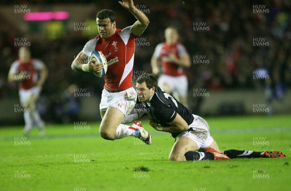 12.02.11 - Scotland v Wales... Wales  Jamie Roberts is tackled by Sean Lamont.. . 