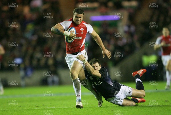 12.02.11 - Scotland v Wales... Wales  Jamie Roberts is tackled by Sean Lamont.. . 