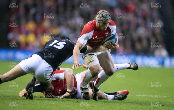 12.02.11 - Scotland v Wales... Wales Jonathan Davies is tackled by Hugo Southwell. 