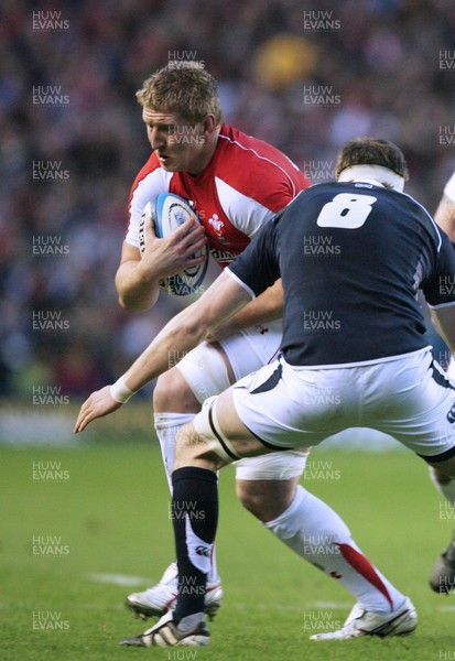12.02.11 - Scotland v Wales... Wales Bradley Davies is tackled by Richie Vernon. 