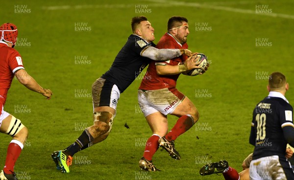 130221 - Scotland v Wales - Guinness Six Nations - Wyn Jones of Wales is tackled by Matt Fagerson of Scotland