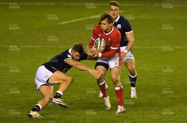 130221 - Scotland v Wales - Guinness Six Nations - Nick Tompkins of Wales is tackled by Chris Harris of Scotland